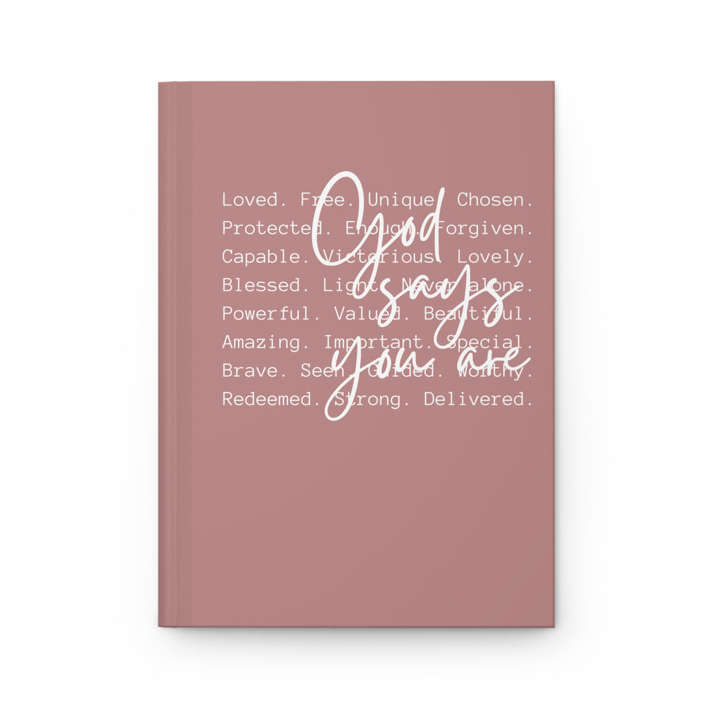 Mauve notebook with motivational text on a white background