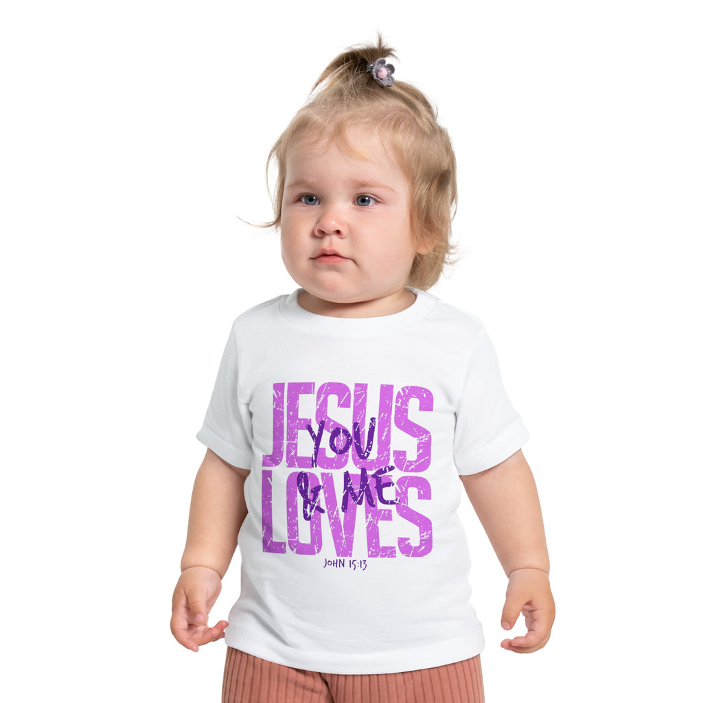 Child wearing a white t-shirt with 'Jesus Loves You & Me' text on a white background
