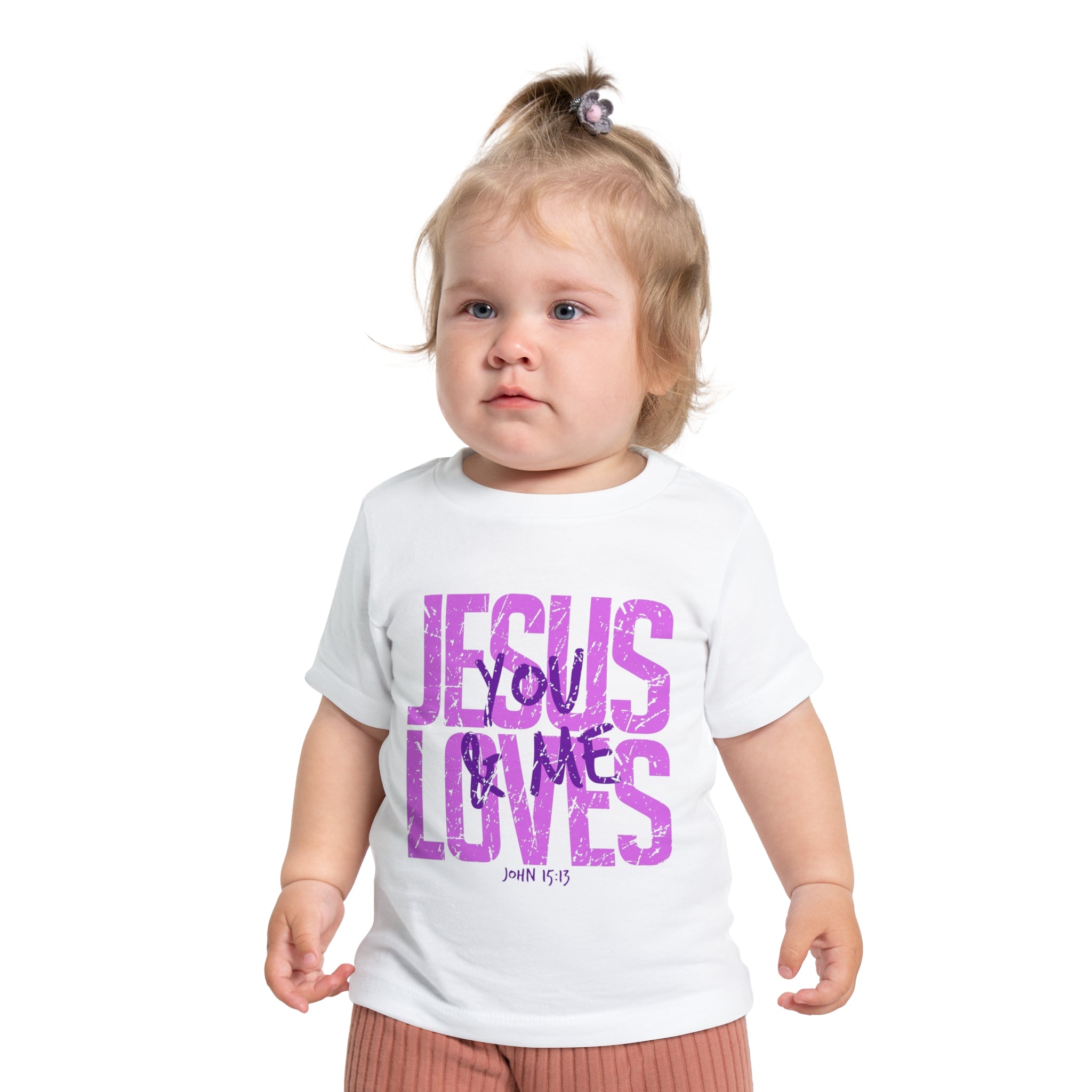 Child wearing a white t-shirt with 'Jesus Loves You & Me' text on a white background
