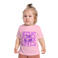 Child wearing a pink t-shirt with 'Jesus Loves You & Me' text on a white background